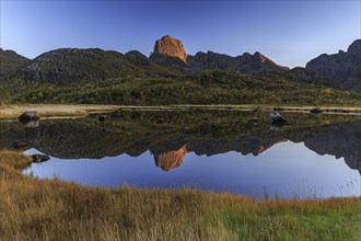 Mountain reflected in lake, autumn, morning light, sunny, Vesteralen, Norway, Europe