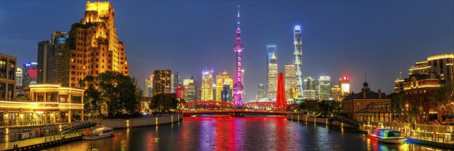 Shanghai skyline at the Bund with Oriental Pearl Tower city centre downtown panorama at night in