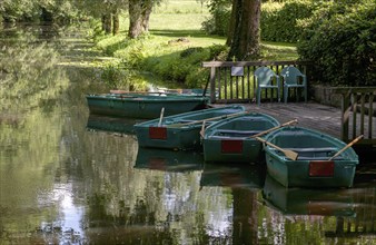 Green boats on the wooden jetty, Alstätter Aa near the Haarmühle, Ahaus-Alstätte, Münsterland,