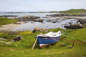 Small fishing boat on the east coast of Barra, Outer Hebrides, Scotland, UK