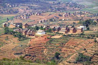 Terraced fields and two stories brick houses in Betsileo rural village in the Ambositra District,