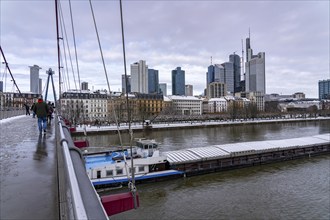 Winter in Frankfurt, view of the skyline of the city centre, from the Holbeinsteg foot and cycle