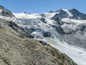 Mountain hut Cabane de Moiry, located close to the retreating Moiry glacier, hiking trail, aerial