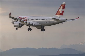 Aircraft approaching Zurich Airport. Registration: HB-JBC, Airbus A220-100, airline Swiss. Zurich,