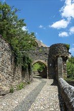 Historic gateway (Porte du Brugelet) leading into the medieval city of Auzon in Haute Loire,