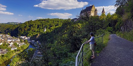 Elevated town view of Vianden with the river Our and the hilltop castle above the town, canton of