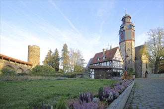 Historic town wall with battlements and witches' tower, Weidig House and Gothic St Mark's Church,