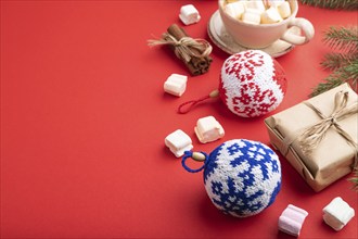 Christmas or New Year composition. Decorations, box, cinnamon, knitted balls, fir and spruce