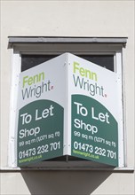 Shop to Let estate agent sign Fenn Wright estate agents, Ipswich, Suffolk, England, UK