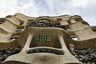 Artfully designed façade, balconies with wrought-iron grilles, view from below, Casa Mila, Casa