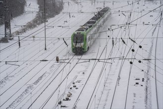 Onset of winter with lots of fresh snow and temperatures below -5 degrees during the day, railway