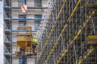 Concreting work on a construction site, new construction of a high-rise office building, facade of