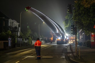 Transport of a 68 metre long, 22 tonne blade of a wind turbine, here in Breckerfeld, with a