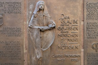 Detail of the memorial plaque at the grave site of the humanist Carita Pirkheimer, former monastery