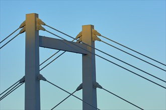 A modern bridge at sunset with clear cable structures and a cloudless sky, Würzburg, Mainfranken,