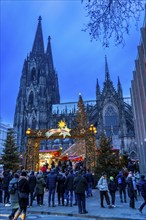 Christmas market at Roncalli Platz am Dom, in the city centre of Cologne, Sunday shopping in