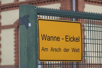 Sign on a building, Wanne-Eickel Am Arsch der Welt, belongs to the city of Herne, Ruhr area, North