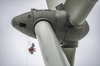 Height rescuers from the Oberhausen professional fire brigade practise abseiling from a wind