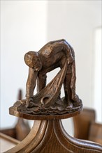 Carved wooden finial figure of fisherman c 1930s by Captain Jackson, Westleton church, Suffolk,