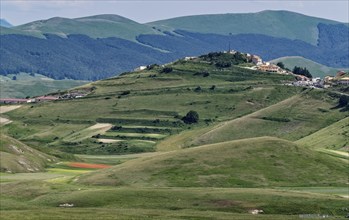 Mountain landscape on the edge of the Pian Grande di Castelluccio di Norcia plateau in the Monti