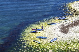 People on paddleboards, White Cliffs. Old Harry Rocks Jurassic Coast, Dorset Coast, Poole, England,