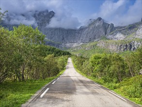 Steep granite cliffs at the road to Nusfjord, narrow single track road, Nusfjord, Flakstadøy,