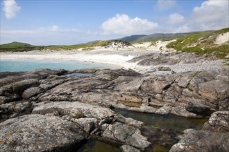 Rocky headland and sandy beach at Bagh a Deas, South Bay, Vatersay island, Barra, Outer Hebrides,