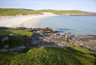 Rocky headland and sandy beach at Bagh a Deas, South Bay, Vatersay island, Barra, Outer Hebrides,