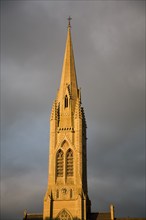 Spire St John's RC church against stormy sky, Bath, Somerset, England, UK