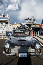 Luxury yachts and vintage cars in the harbour, Aston Martin, St. Tropez, Département Var, Cote