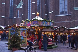 Europe, Germany, Hamburg, Christmas market in front of St Peter's Church, children's carousel,