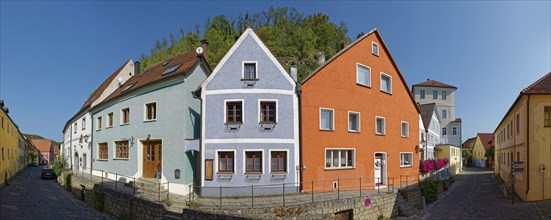 Vils alley with colourful houses and clear sky casting shadows, Kallmünz, Upper Palatinate,