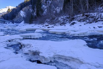 Inn or En near Scuol in winter, with ice floes, Engadin, Grisons, Switzerland, Europe