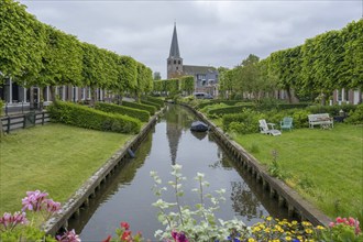 Church and river Ee with the bleaching meadows, Ijlst, province of Friesland, Netherlands