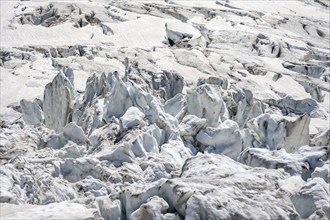 Rutted glacier ice with crevasses, high alpine mountain landscape, La Jonction, Chamonix,