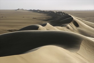 Sand dune belt and sunrise in the Erg of Bilma, a Dune Sea in the Ténéré desert region of the south