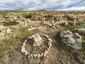 At the polar center, Arctic Circle at road E6, 66.33 degree north, Saltfjell, hundreds of cairns