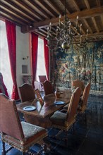 Kasteel van Laarne, interior showing antique dining room and tapestry inside 14th century medieval