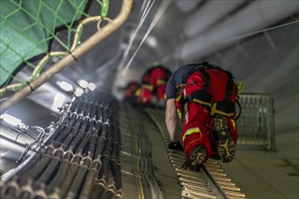 Height rescuers from the Oberhausen professional fire brigade practise abseiling from a wind