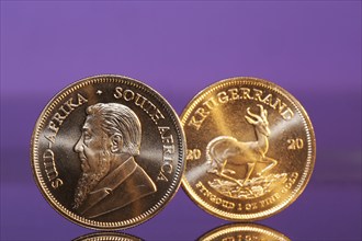 Close-up of two Krugerrand gold coins