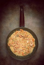 Shrimp in creamy garlic sauce, with spices and herbs