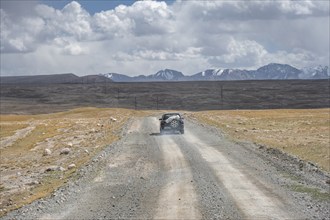 Off-road vehicle on a gravel track, near Kumtor, Kara-Say, Tian Shan, Kyrgyzstan, Asia