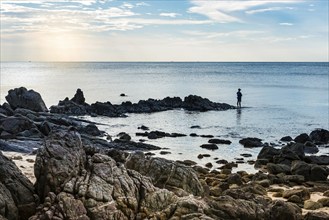 Angler on the coast of Ko Lanta, man, alone, hobby, travel, holiday, tourism, sea, leisure,