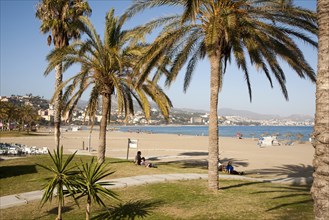 Playa de Malaguera sandy beach people sunbathing by the sea, Malaga, Spain, Europe