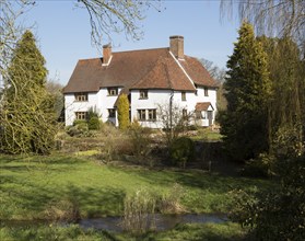 Large detached country home with garden and stream, near Kersey, Suffolk, England, UK