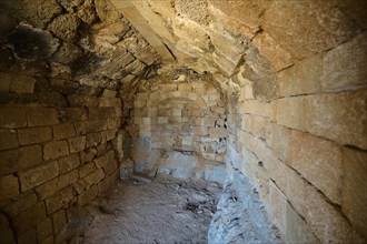 Interior view of an old building with stone walls and vaulted ceiling, tomb of Cleovoulos the