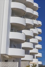 Modern holiday flats with round balconies at the harbour of Santa Eularia, Ibiza, Balearic Islands,