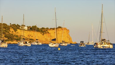 Sailing yachts in the bay of Talamanca, behind the rock Punta de s'Andreus, Eivissa, Ibiza Town,