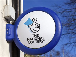 Close up of The National Lottery fingers crossed sign, UK