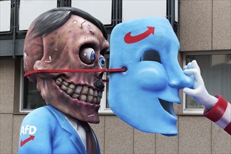 Behind the mask of the AFD hides the skull of Hitler, papier-mâché figures, satirical themed parade